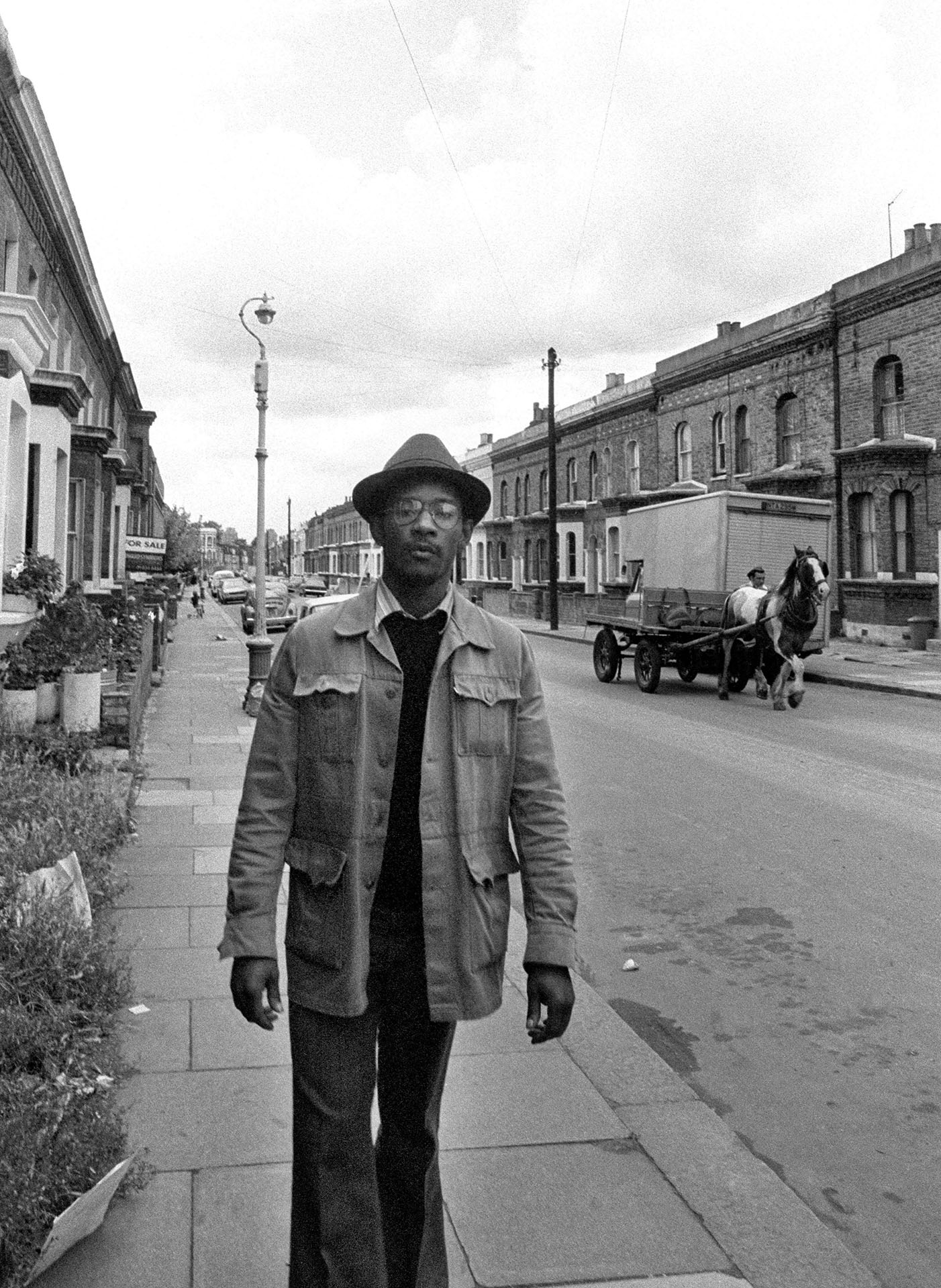 Photo of Linton Kwesi Johnson (LKJ) on Railton Road Brixton - Race Today office 1979